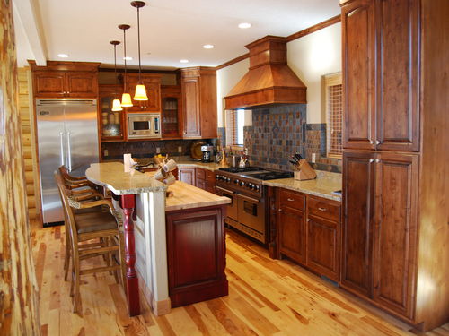 granite counter top, viking appliances, hardwood floors