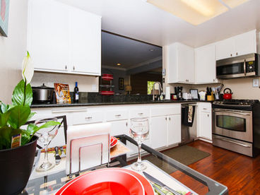 Large and fully equipped modern kitchen with all new appliances and breakfast table. 