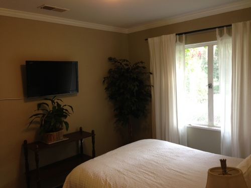 Bedroom with Full bed and beautiful Courtyard garden view