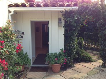 Cottage Entry with gated parking just outside the door. 