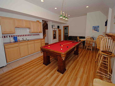 Large rec room with pool table, wet bar and refrigerator