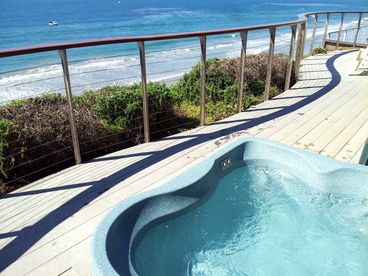 Kick back in the relaxing spa right over looking the Pacific Ocean