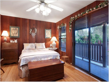 Comfortable Queen bedroom has a ceiling fan, 