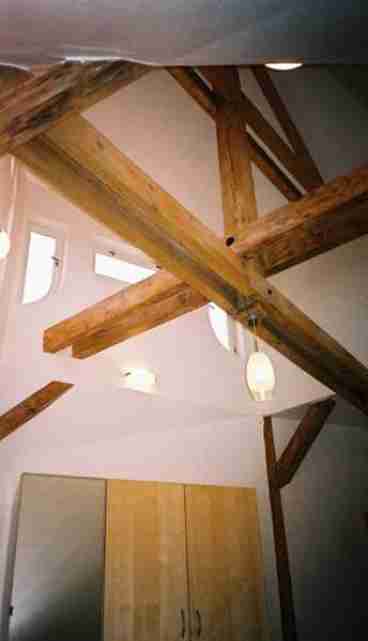 Wooden Beams Above Bed in Main Bedroom
