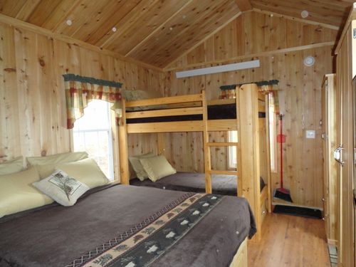 Studio cabin with queen bed and bunk bed. Kitchenette and private bath.