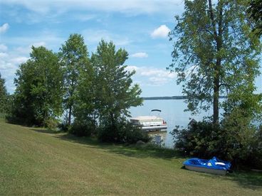 Directly on Big Manistique Lake.  Paddleboat and canoe included :) 