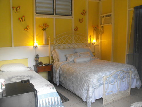 This room has a full bed,twin bed,mini refrigerator,a/c,fan,bathroom