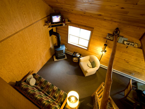 looking from the loft to the living room of the 3 bedroom upper unit