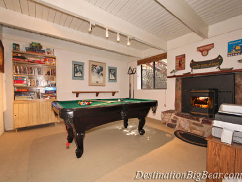Game room with a pool table, darts and plenty of board games, movies and a flat screen TV