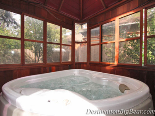 HOT TUB situated under a gazebo with a covered ceiling that you can see through, perfect for star gazing!