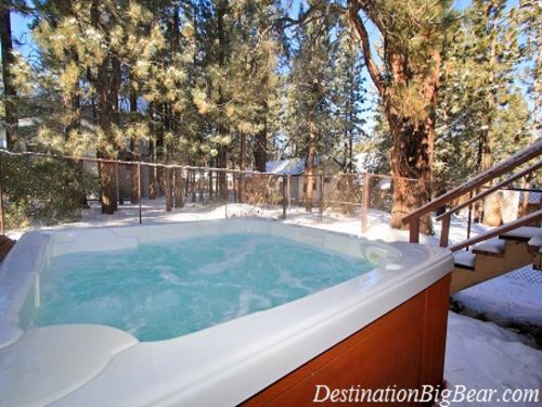 Private hot tub in fenced in backyard