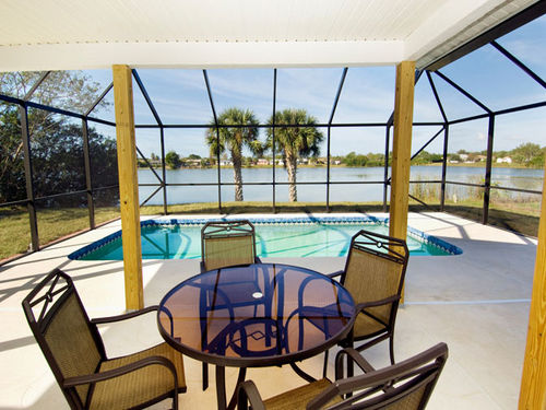 View from the lanai over the pool onto the lake