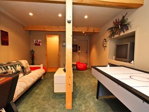A separate game room with a full futon bed, FOOSBALL and AIR HOCKEY table plus TV/DVD