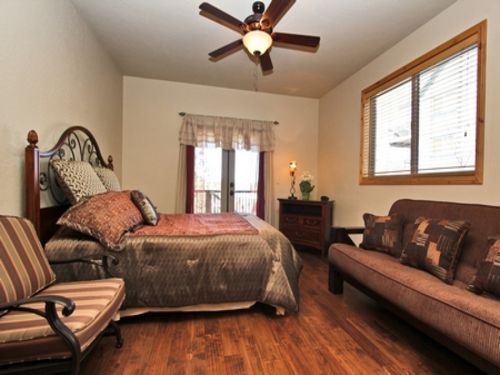 The master bedroom features a wood burning fireplace