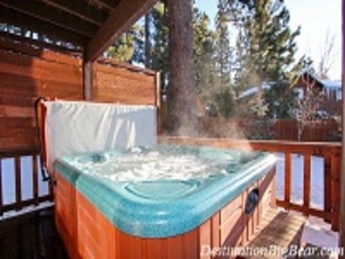 As you exit the kitchen onto the spacious deck, you will find the 6 person HOT TUB