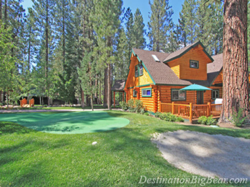 The grounds feature a putting green, fully FENCED in yard and FLAT