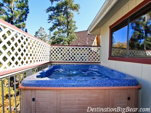 Sit back and relax in the 8 person HOT TUB on the outside deck overlooking beautiful pine trees