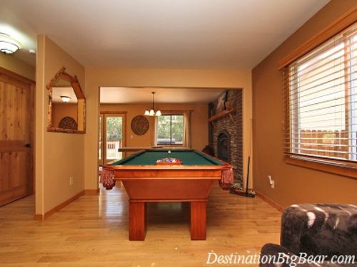 The living room has a flat screen TV, DVD player and POOL TABLE!