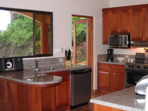 Gourmet Kitchen with Stainless steel Appliances - Breakfast bar and French door to Outdoor Dining area