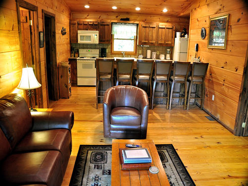 This single level log cabin has 3 bedrooms and 2 baths for plenty of room to spread out. You can take in the Great Outdoors after a long day of adventure on the covered porch with ceiling fans to catch fresh breezes.