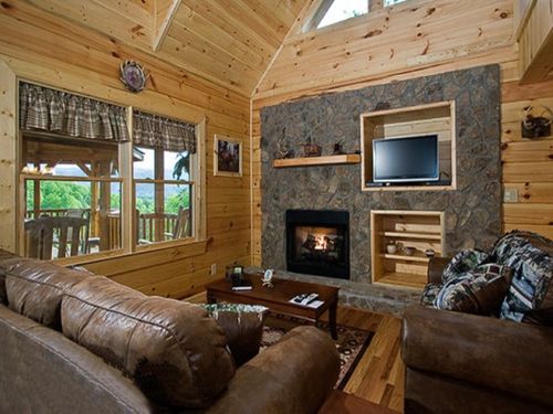 Bask in the Warmth of the Gas Fireplace and Relax on the Leather Sofas Enjoying the Satellite TV