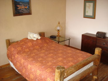 This wood floor guest room also has a nice view of the forest and town, and next to the hall bathroom.