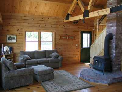 Living log home style... warm and cozy with grand views out every window.