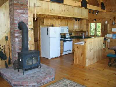 Log Home living does mean living without... a fully equipped kitchen awaits your arrival.