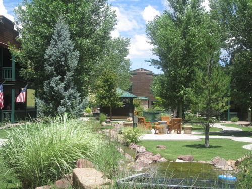 Courtyard with outdoor BBQ grill and water features.