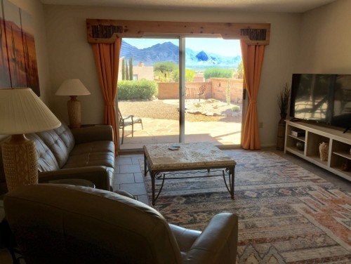 Fantastic view of the Santa Rita Mountains from inside and outside on the partially covered flagstone patio.  Private courtyard, beautifully furnished.