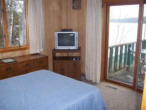 Master bedroom with private deck and great view of lake
