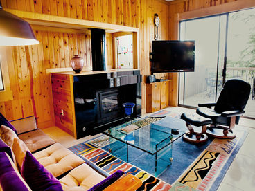 Big Flat Screen TV and Granite Fireplace