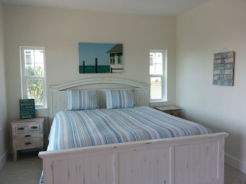 Master suite with king bed, en suite bath with separate shower and tub and walk in closet