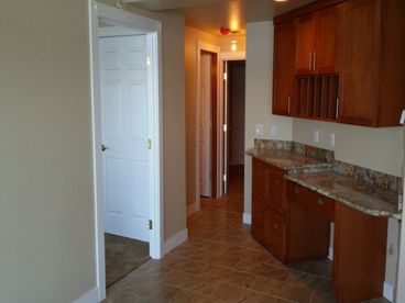 Desk leads to Home Theatre Room / Pool Room & Guest Bath