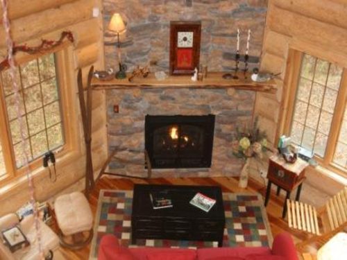 Great room with 23\' high fireplace and antique decorating
