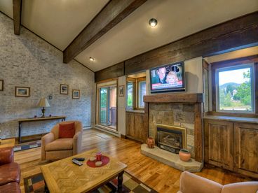View of Living Area below with Vaulted Ceilings, Gas Fireplace, Flat Screen TV