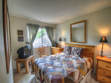 Bedroom With Queen Bed and Flat Screen TV