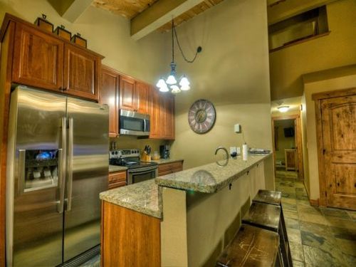 Open Floor Plan Fully Equipped Kitchen with Granite Counter Tops, and Stainless Appliances