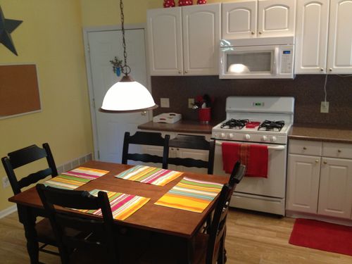 Kitchen features full size refrigerator and dishwasher.  Laundry is located just off the kitchen area.