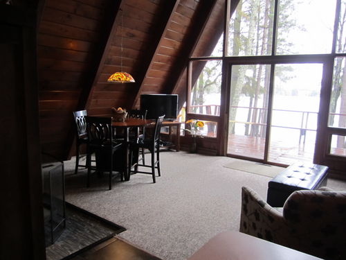 Flat Panel TV with DVD. Dining area.  Wood Stove.  And the absolutely wonderful view!