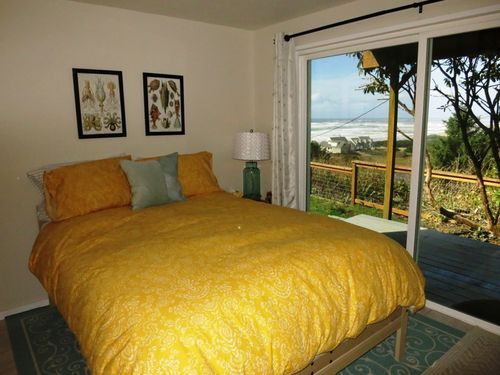 Maggies Retreat- Main floor bedroom 1 with ocean view/ deck with Queen