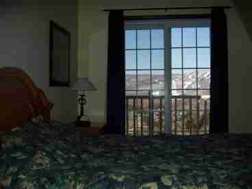 Master bedroom with balcony and great view of Mont Tremblant.