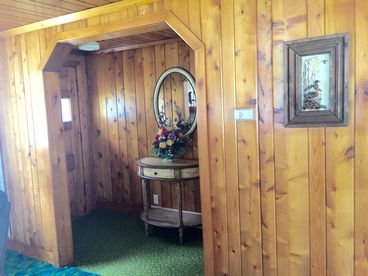 Front door foyer with an adjacent coat closet.  This is not the door you\'ll enter from.