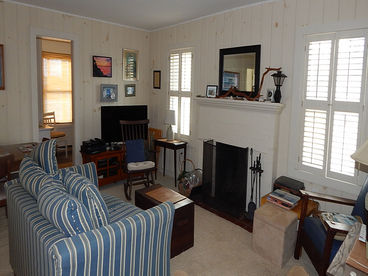 Living room with tv,off kitchen and sun room