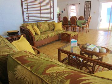 Beach house tropical style  living room area with Caribbean design Decorations, flat screen T.V music system and WiFi. 