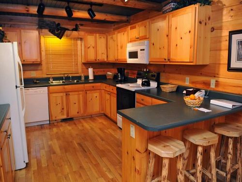 Large, fully equipped kitchen with hand-hewn Montana beams.