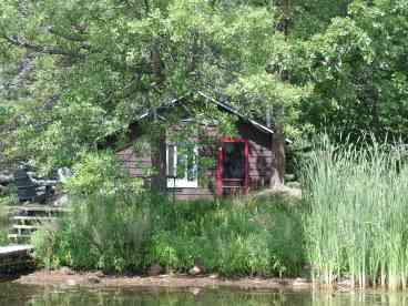 Picnic table, fire-ring and dock at every cabin.