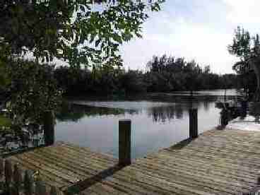 120 foot of deep water dockage totally surrounded by mangroves.  Quick access to open bay water.