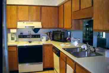 In addition to the normal kitchen fare, the fully-appointed kitchen contains a microwave, food processor, coffee maker, toaster, blender, vegetable steamer, mixer, crockpot, fine cutlery, faucet water filter, dishwasher, and a washer/dryer.