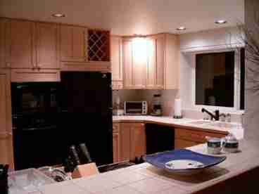 Spacious gourmet kitchen with a view of the ocean